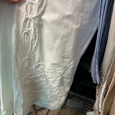 ROLLING CLOTHES RACK, LINENS AS PICTURED