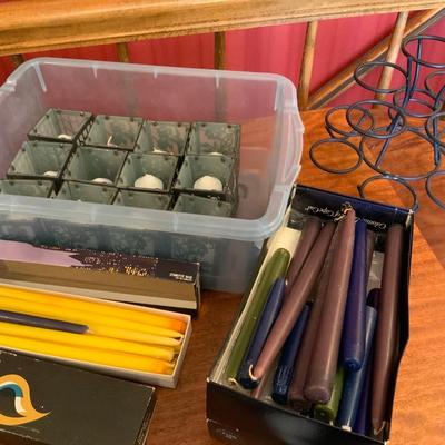 Lot of candles, including a cupcake holder