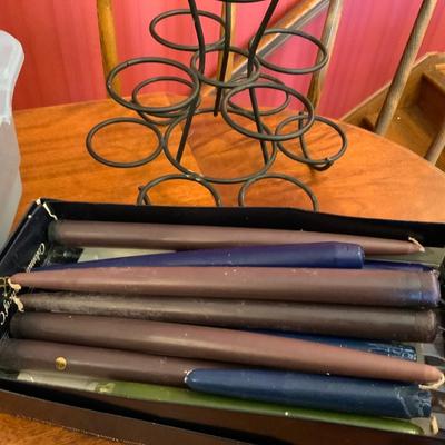 Lot of candles, including a cupcake holder