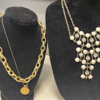 4 Gold tone necklaces