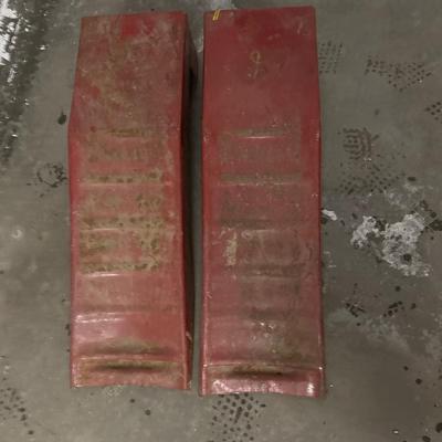 Red metal car ramps
