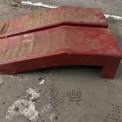 Red metal car ramps