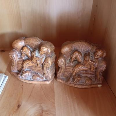 VARIETY OF BOOKS, BOOK ENDS AND A CAST IRON DOOR STOP