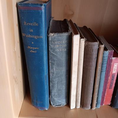 VARIETY OF BOOKS, BOOK ENDS AND A CAST IRON DOOR STOP