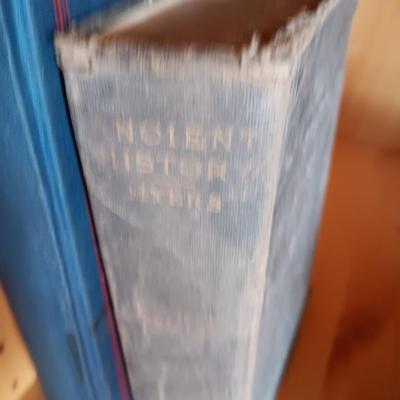 VARIETY OF BOOKS, BOOK ENDS AND A CAST IRON DOOR STOP