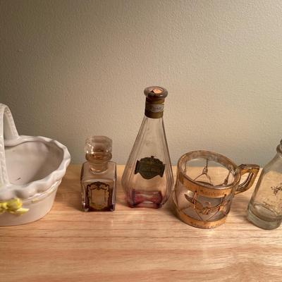 Vintage perfume bottles and cup
