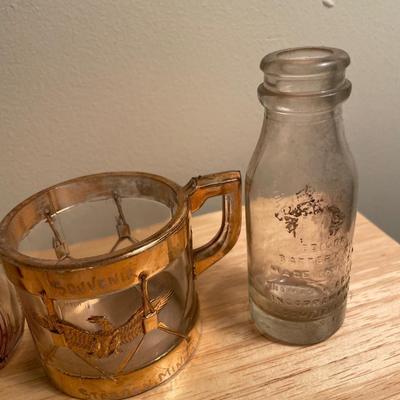 Vintage perfume bottles and cup