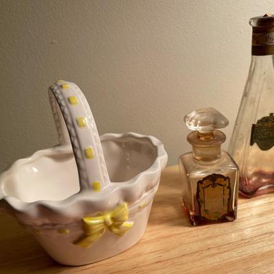 Vintage perfume bottles and cup