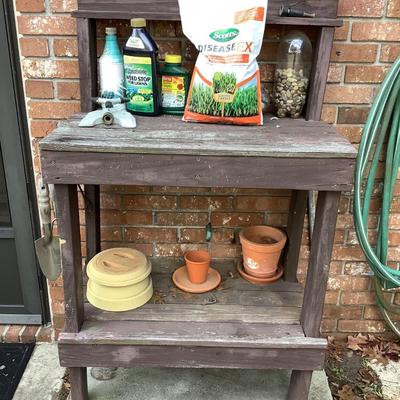 Potting table and all on it lot