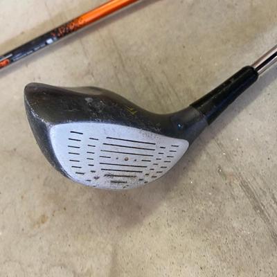 PING AND ARNOLD PALMER DRIVERS, A PIECE OF GREEN TO TEE OFF WITH A BASKET OF GOLF BALLS
