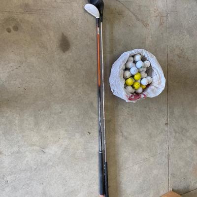 PING AND ARNOLD PALMER DRIVERS, A PIECE OF GREEN TO TEE OFF WITH A BASKET OF GOLF BALLS