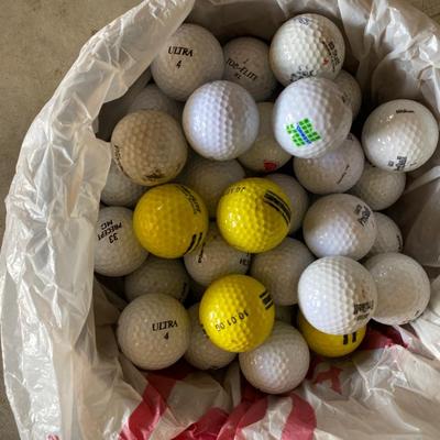 PING AND ARNOLD PALMER DRIVERS, A PIECE OF GREEN TO TEE OFF WITH A BASKET OF GOLF BALLS