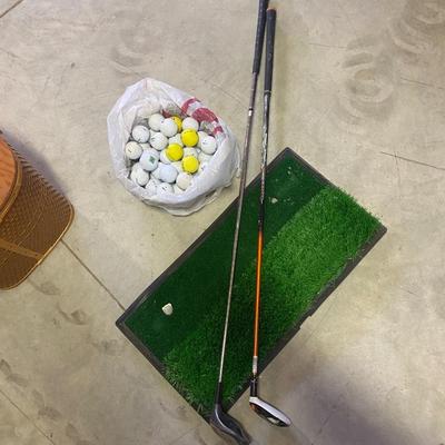 PING AND ARNOLD PALMER DRIVERS, A PIECE OF GREEN TO TEE OFF WITH A BASKET OF GOLF BALLS