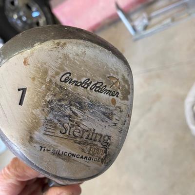 PING AND ARNOLD PALMER DRIVERS, A PIECE OF GREEN TO TEE OFF WITH A BASKET OF GOLF BALLS