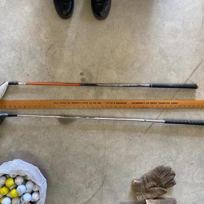 PING AND ARNOLD PALMER DRIVERS, A PIECE OF GREEN TO TEE OFF WITH A BASKET OF GOLF BALLS