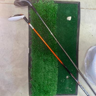 PING AND ARNOLD PALMER DRIVERS, A PIECE OF GREEN TO TEE OFF WITH A BASKET OF GOLF BALLS