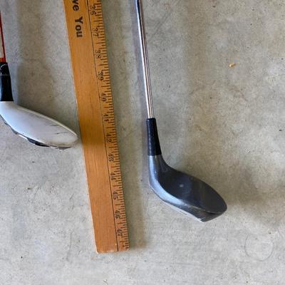 PING AND ARNOLD PALMER DRIVERS, A PIECE OF GREEN TO TEE OFF WITH A BASKET OF GOLF BALLS