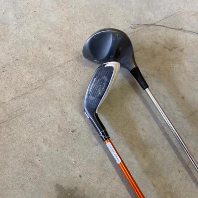 PING AND ARNOLD PALMER DRIVERS, A PIECE OF GREEN TO TEE OFF WITH A BASKET OF GOLF BALLS