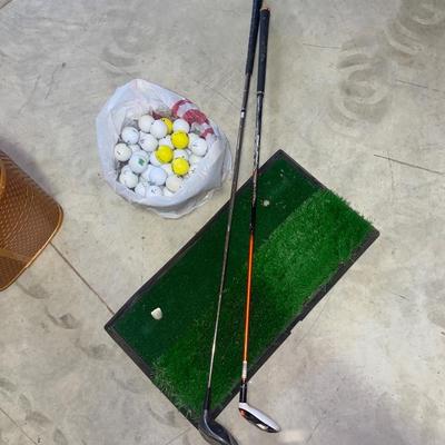 PING AND ARNOLD PALMER DRIVERS, A PIECE OF GREEN TO TEE OFF WITH A BASKET OF GOLF BALLS