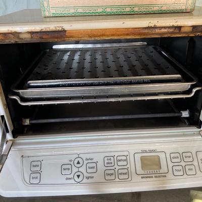 CUISINART TOASTER OVEN AND A BOX OF FLATWARE