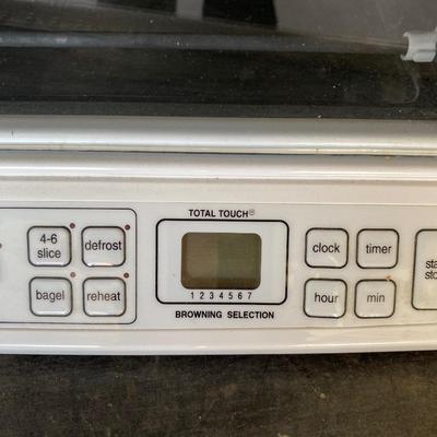 CUISINART TOASTER OVEN AND A BOX OF FLATWARE