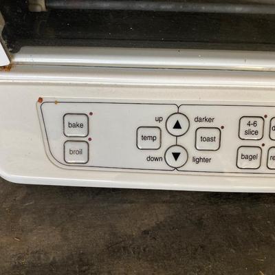 CUISINART TOASTER OVEN AND A BOX OF FLATWARE