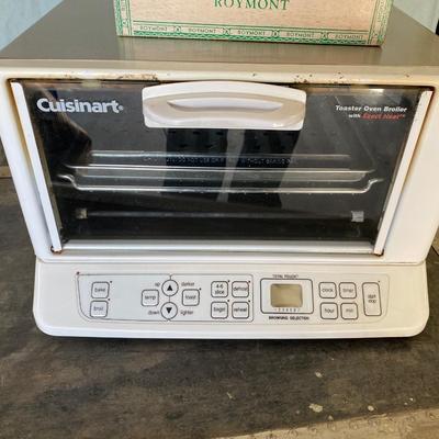 CUISINART TOASTER OVEN AND A BOX OF FLATWARE