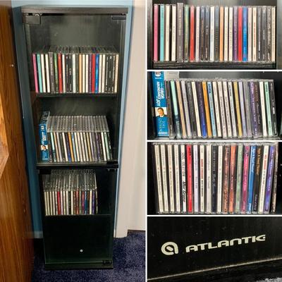LOT 17 O: Atlantic CD/DVD 4 Tier Glass Door Front Shelving Unit w/ CD's: Neil Diamond "Up On The Roof", Elvis Presley The...