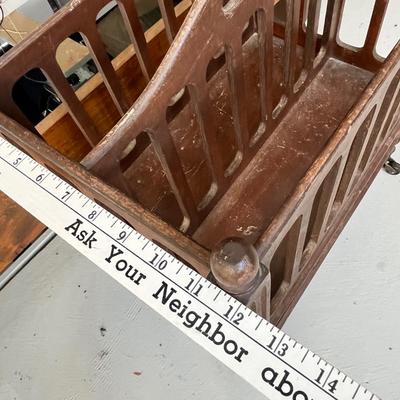 Lot 224 Antique Magazine rack on wheels