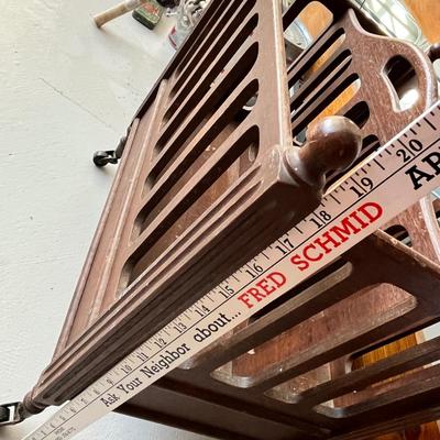 Lot 224 Antique Magazine rack on wheels