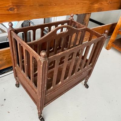 Lot 224 Antique Magazine rack on wheels