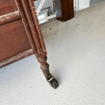 Lot 224 Antique Magazine rack on wheels