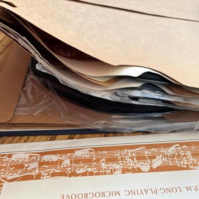 Lot 238 Norman Rockwell Saturday Evening Post magazine, Music Appreciate records in album, 88 Ford Bronco book, 79 Corvette owners manual