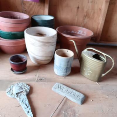 A VARIETY OF FLOWER POTS AND 2 STAKED SIGNS