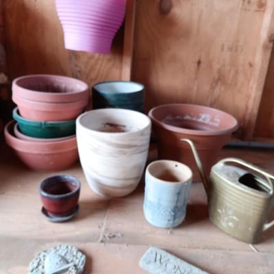 A VARIETY OF FLOWER POTS AND 2 STAKED SIGNS