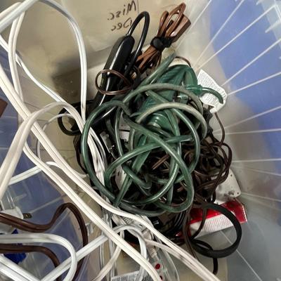 Lot 289 rubbermaid box of cords and power strips