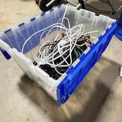 Lot 289 rubbermaid box of cords and power strips