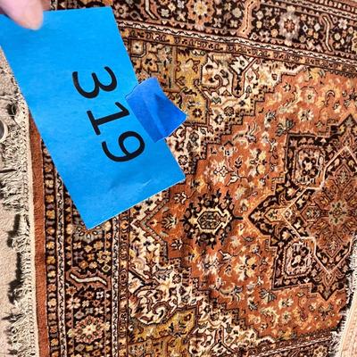 Lot 319 orange area rug (good condition) possibly kerestan