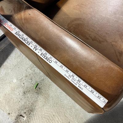 Lot 232 Brown leather oversized chair with sleeper bed