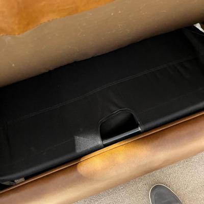 Lot 232 Brown leather oversized chair with sleeper bed