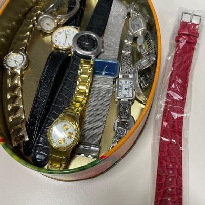 Tin with ladies watches
