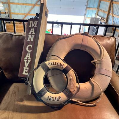 Lot 326 Man Cave sign and two life preservers wall art