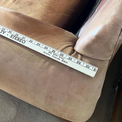 Lot 334 Leather arm chair brown, faded to tan