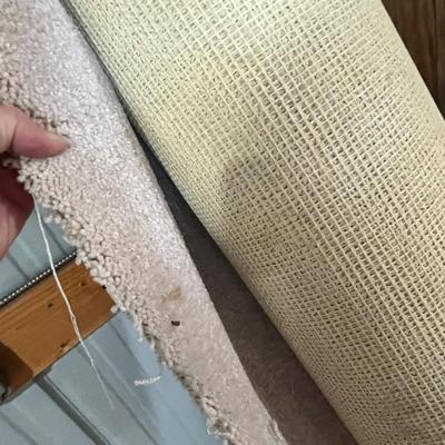 Lot 347 remanans of light beige carpet in the barn