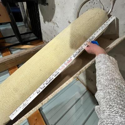 Lot 347 remanans of light beige carpet in the barn