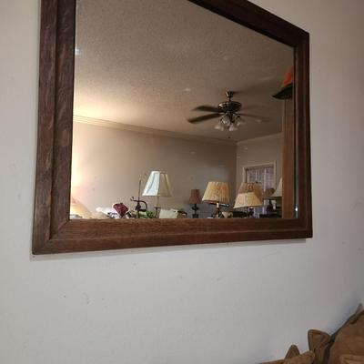 Wood framed wall mirror.