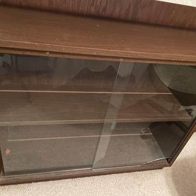Small display cabinet with glass doors