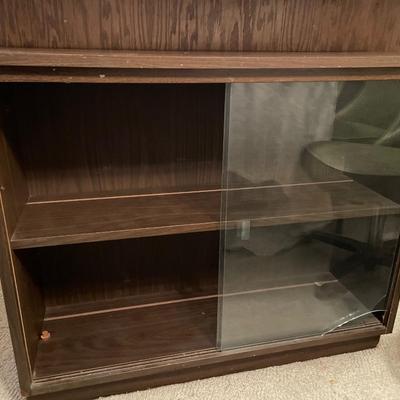 Small display cabinet with glass doors