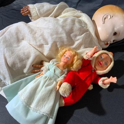 Lot of Dolls and Doll Clothes, Including a dolly bed