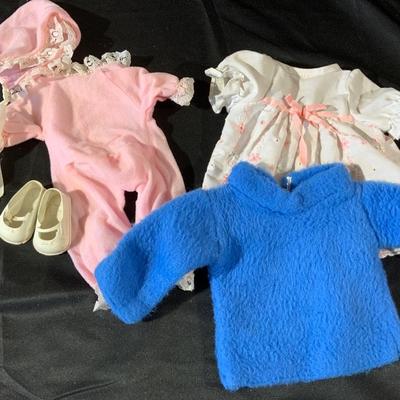 Lot of Dolls and Doll Clothes, Including a dolly bed